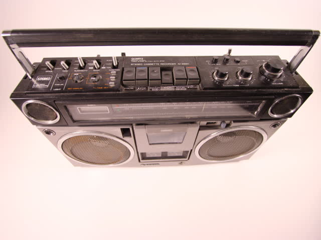 ghetto blaster spits out cassette tape