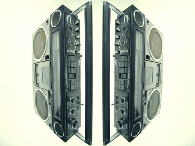 ghetto blaster spits out cassette tape