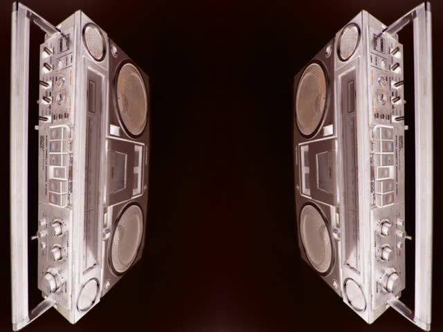 ghetto blaster spits out cassette tape