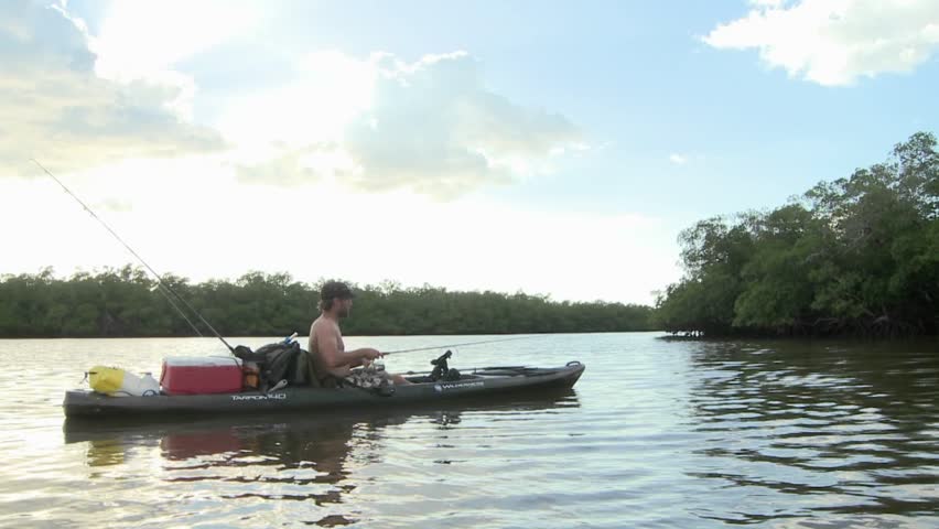 FLORIDA - CIRCA 2009: Kayaker fishes between islands circa 2009 in the Everglades.
