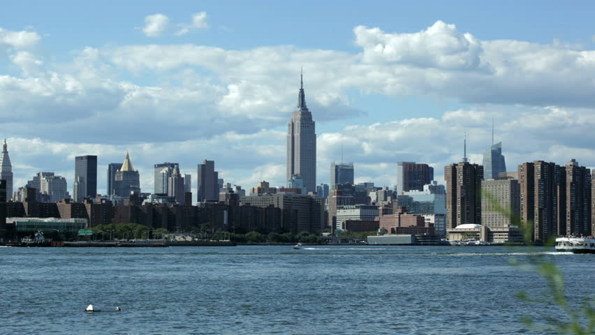 NEW YORK - AUGUST  11: (Timelapse View) East river and the arrival of a New York City water taxi with the Empire State building in in the background on August 11, 2011 in New York. 