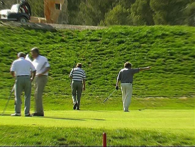 Group of golfers at the ditch