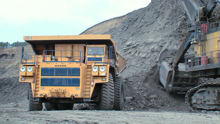 A large multi-ton truck with coal 