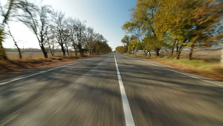 driving a car along a country road in autumn, Wide shot 