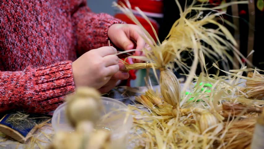 Process of bast braiding lesson, only hands visible