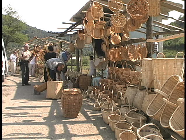 August - 2008 - Republic of Georgia - Basket vendor with wares for sale in market
