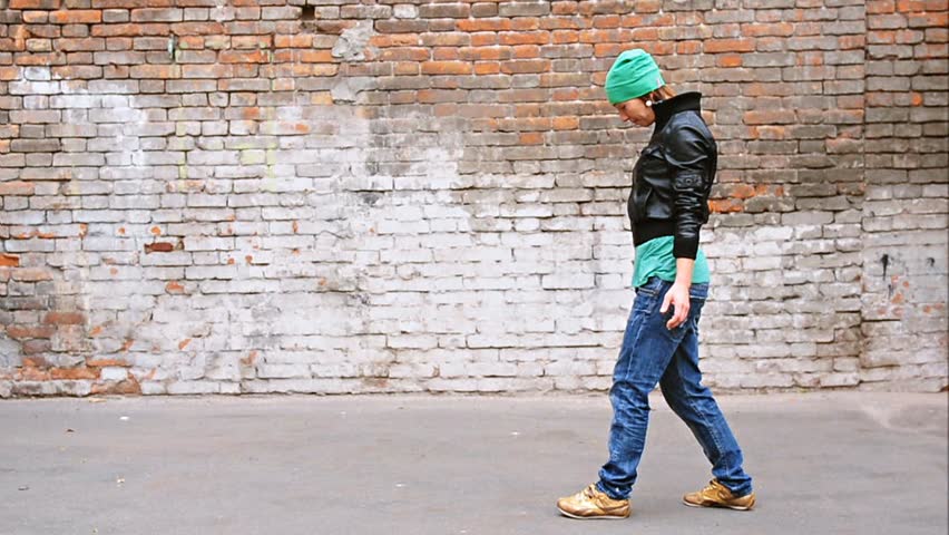 young female dancer walking on hands