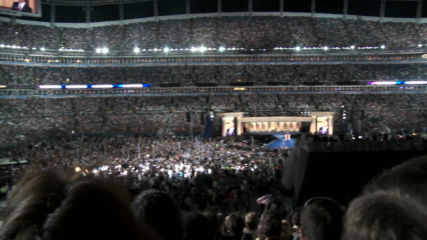 DENVER, COLORADO - CIRCA 2008: A pan of a packed Invesco Field as Presidential Nominee Barack Obama delivers his acceptance speech during the final night of the 2008 Democratic National Convention.