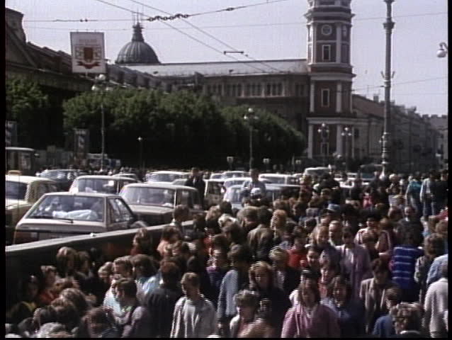 MOSCOW, RUSSIA - CIRCA 1970: Crowds mill on the streets of the old Soviet Union in this archival shot.