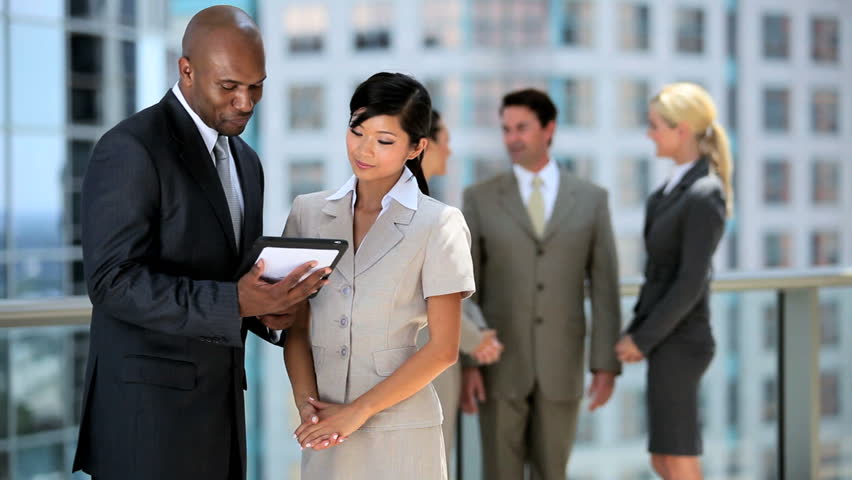 Multi Ethnic Business Team Hearing Good News