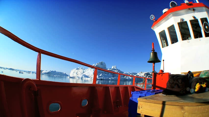 Nautical Vessel Sailing Past Icebergs