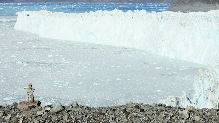 Lone Female on Hiking Expedition by a Glacier