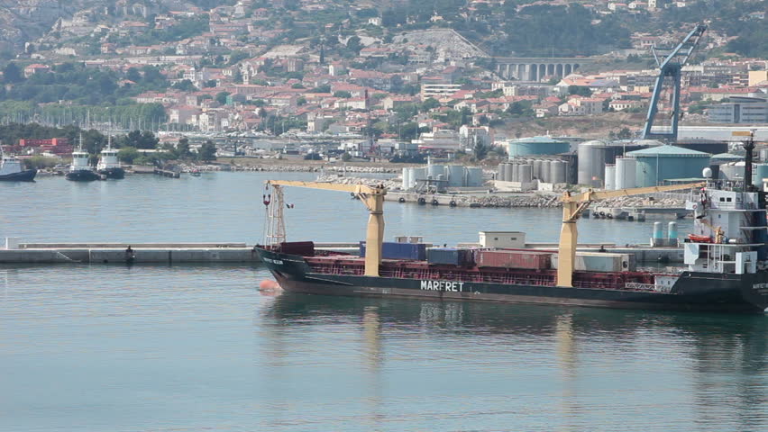 MARSEILLE, FRANCE MAY 23: Cargo ship departing port into Mediterranean Sea May 23 2011 in Marseille France 