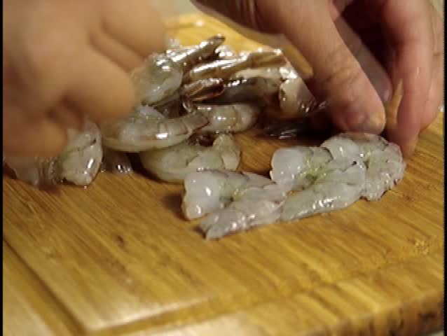 Shrimp peeling food preparation by a chef