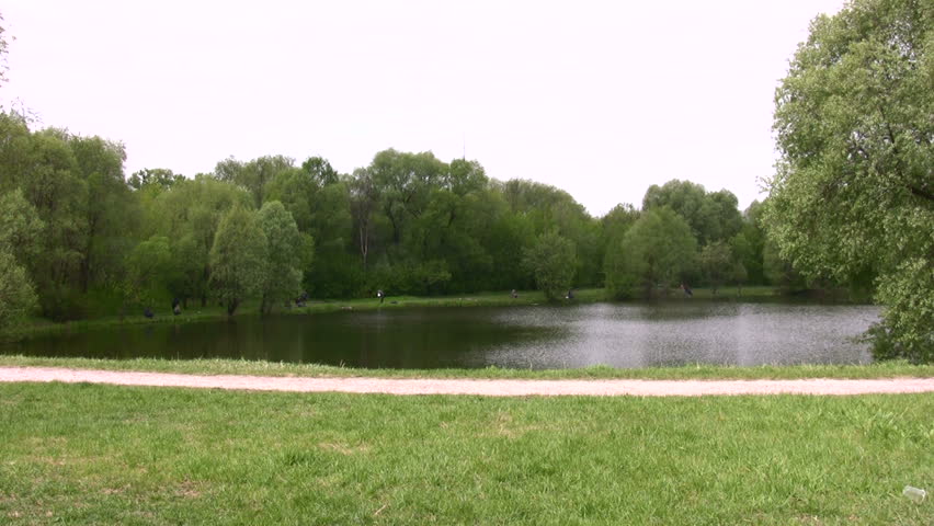 couple on scooter in park