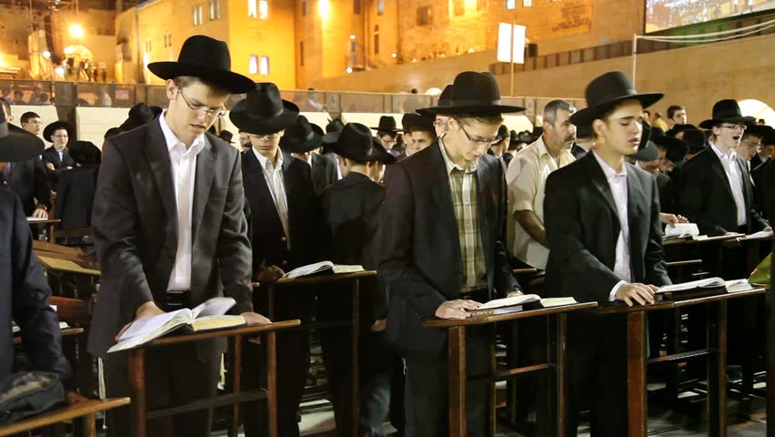 JERUSALEM, ISRAEL - OCT 6, 2011: Yeshiva students pray during Slihot at the Western Wall on October 6, 2011 in Jerusalem.