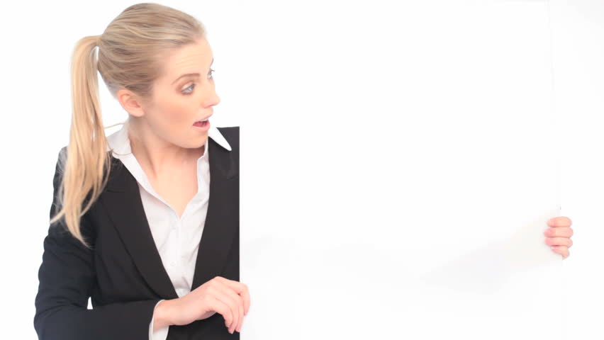 Surprised Bussinesswoman Looking At Blank Card held vertically with copyspace.
