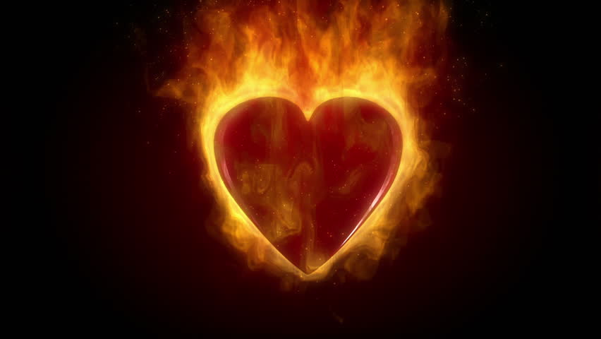 Burning red heart in flames