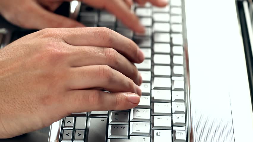 Closeup of a worker using a laptop computer 