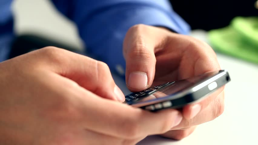 Man writing a sms whit his phone