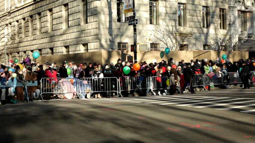 NEW YORK CITY, NY - NOVEMBER 24: Crowds of people along fence waiting for Macy's parade on November 24, 2011 in New York City, New York. 