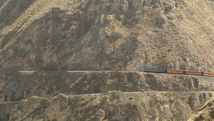 Ecuadorian train passing through Nariz Del Diablo, very popular tourist attraction in Andes due to the difficulty of the route.