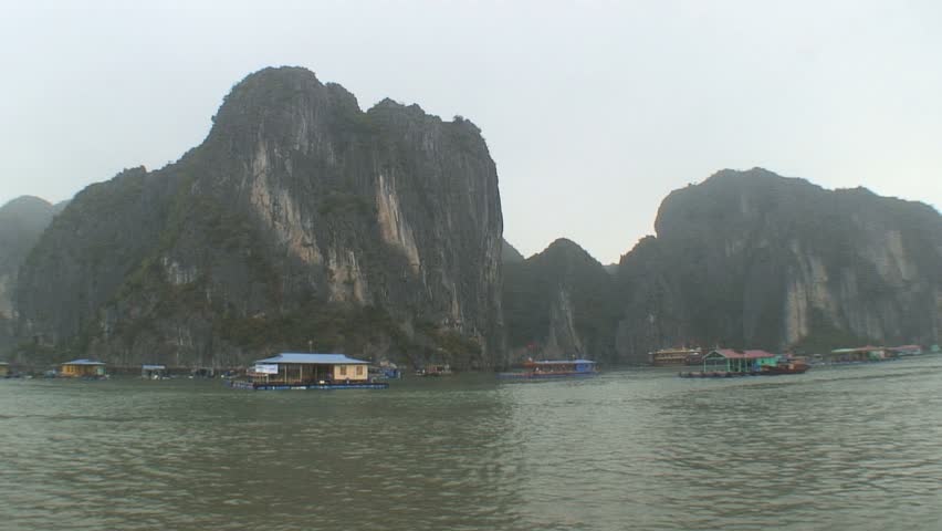 Steep cliffs, houseboats and ships