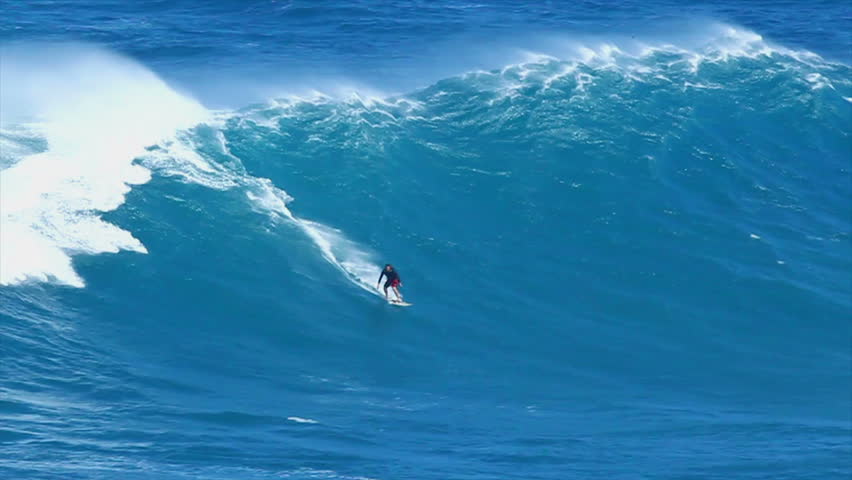 MAUI, HI - MARCH 13: Professional surfer Yuri Soledade rides a giant wave at the legendary big wave surf break known as "Jaws" during one the largest swells of the winter March 13, 2011 in Maui, HI.