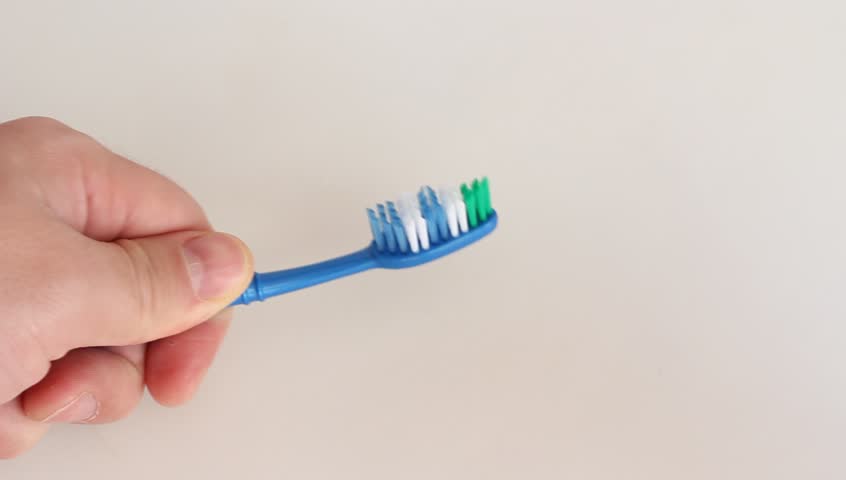 Toothpaste smear on a blue toothbrush. HD H.264