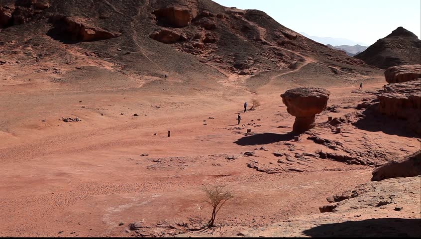 Tourists traveling on geological national park "Timna" (Israel)