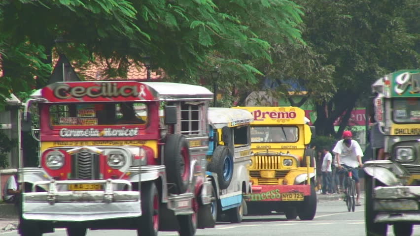 MANILA,  PHILIPPINES - CIRCA 2011: Colorful buses in downtown Manila, Philippines