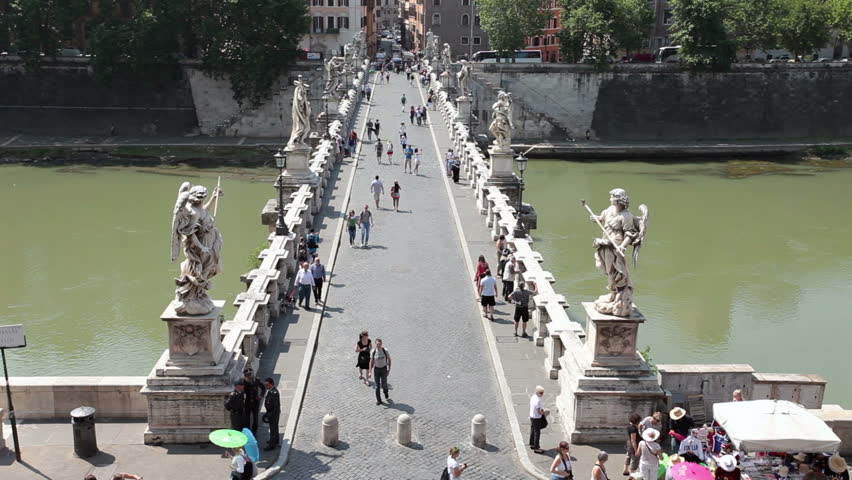 ROME, ITALY MAY 25, 2011: Spectators cross Bridge of Angels at Castel Sant Angelo over Tiber River Rome. Famous crossing between Vatican City and Rome. Fast timelapse. Economic boost to Italy.