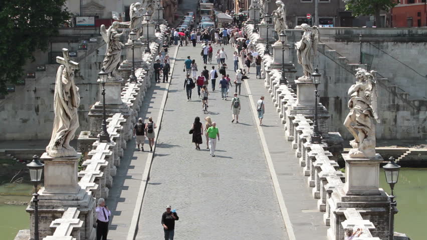 ROME, ITALY MAY 25, 2011: People cross Bridge of Angels at Castel Sant Angelo over Tiber River Rome. Famous crossing between Vatican City and Rome. Fast timelapse close. Economic boost to Italy.