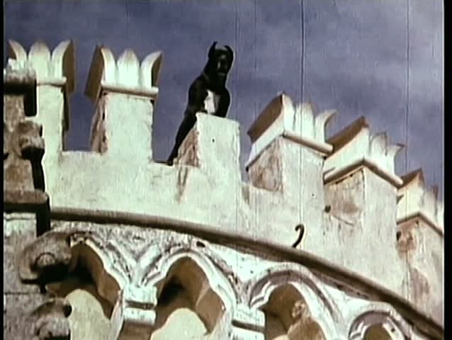 Great Dane guarding castle from rooftop