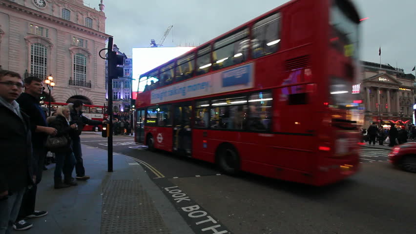 LONDON, UK - DECEMBER 27: Double decker buses and other traffic drive on Piccadilly Circus on December 27, 2011 in London, UK. Piccadilly Circus is a famous entertainment area in London.