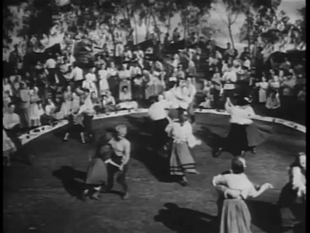 Wide shot of gypsies dancing