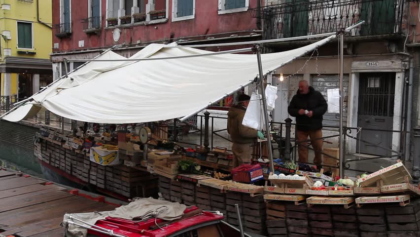VENICE - JANUARY 4: Fruit selling on a boat in a canal, January 4, 2012 in Venice. 