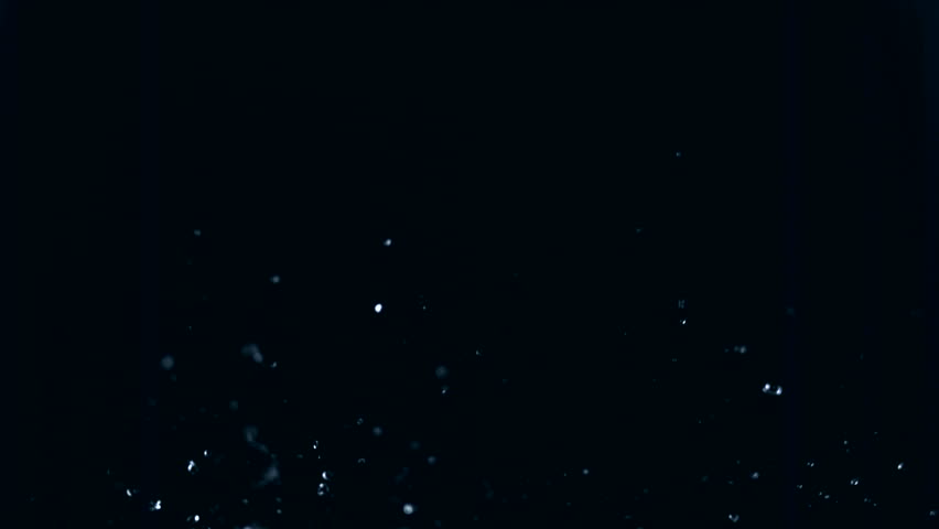 Slow-motion rain size droplets against black drop shooting with high speed camera, phantom flex.