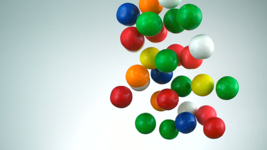 Slo-motion bubble gum balls in the air