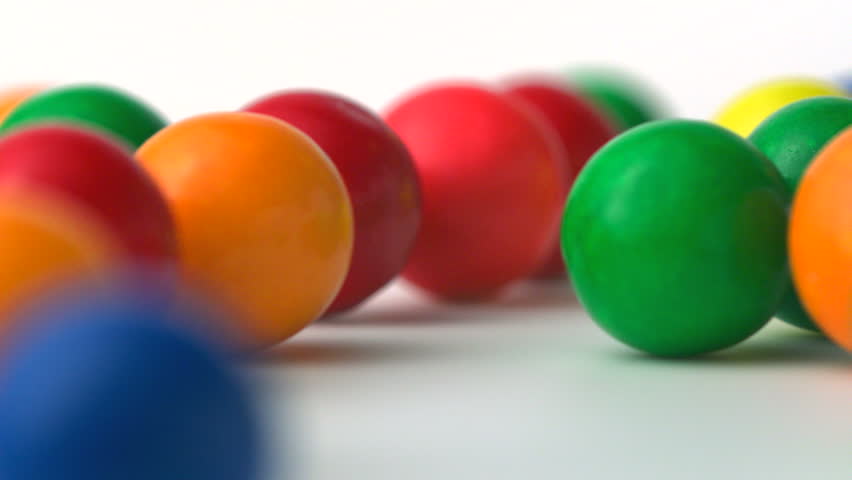 Extreme close-up gumballs rolling, Slow Motion