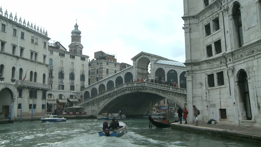 Boating through the Rialto Bridge on the Canale Grande on 24th of February in Venice, Italy