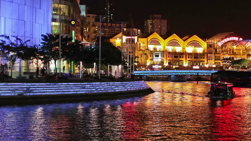 SINGAPORE - NOVEMBER 18: Clarke Quay, colorfully illuminated at night on November 18, 2009 in Singapore. The historic riverside quay is also a well-known nightlife district.