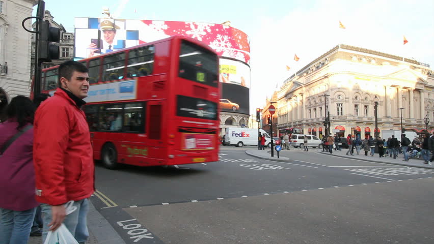 LONDON, UK - DECEMBER 27: Tourists, busses and other traffic on Piccadilly Circus drive by on December 27, 2011 in London, UK. Piccadilly Circus is one of the main entertainment areas of London.