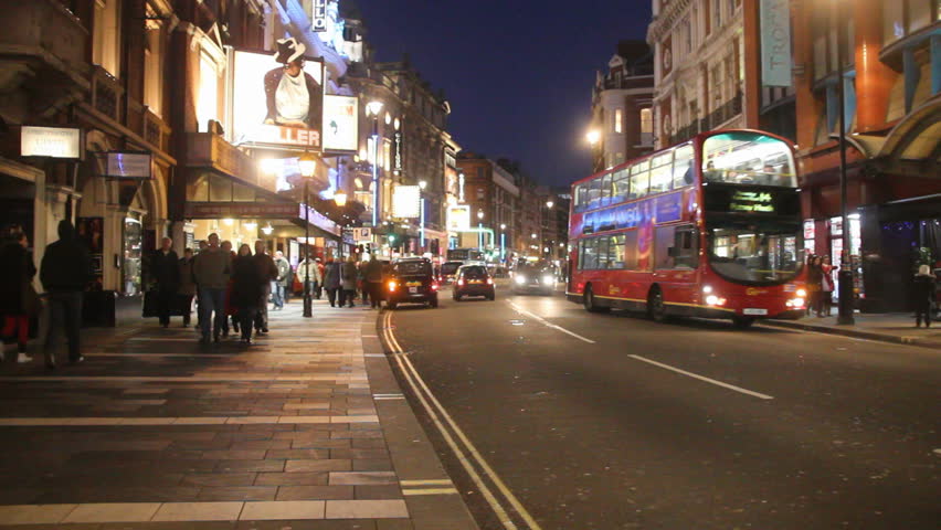 LONDON, UK - DECEMBER 28: Tourists, busses and other traffic on Shaftesbury Avenue drive by on December 28, 2011 in London, UK. Shaftesbury Avenue is the location of many theaters in London.