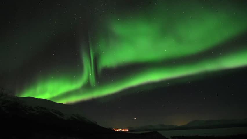 Aurora borealis over an arctic mountain