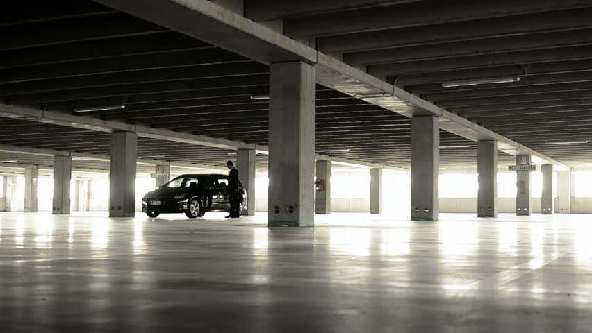 Businessman parking his car and going away; Full hd photo JPEG