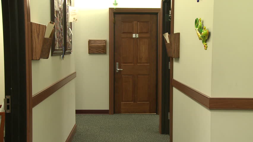 Doctor and nurse have hallway discussion