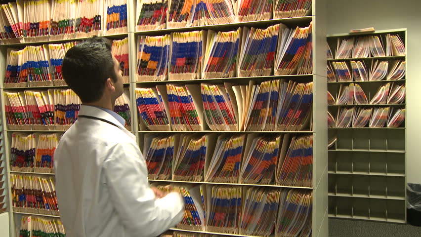 Nurse helps doctor find chart