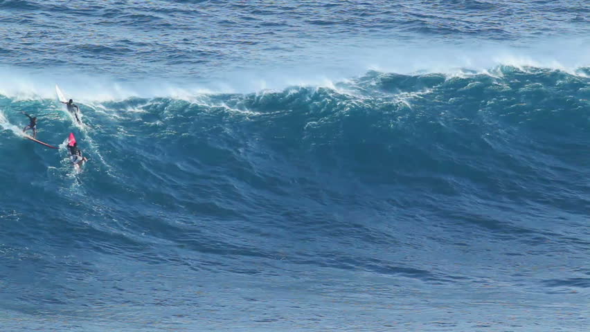 MAUI, HI - January 31: Professional surfer Kai Lenny rides a giant wave at the legendary big wave surf break known as "Jaws" during one the largest swells of the winter January 31, 2012 in Maui, HI.
