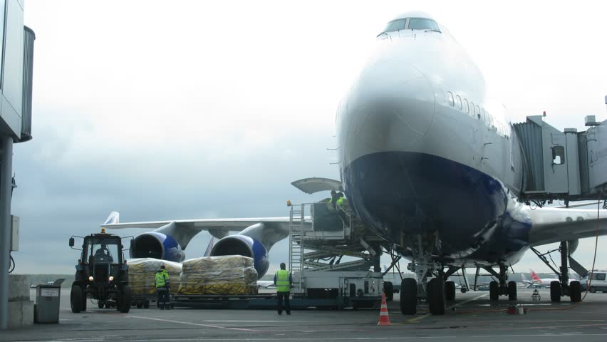 MOSCOW - SEP 1: (Timelapse View) Workers of airport Domodedovo unload plane working machines take away load, on Sep 1, 2011 in Moscow, Russia